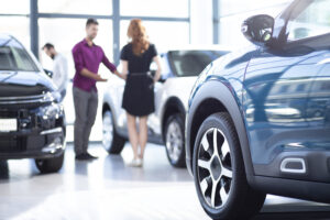 customer and car salesman talking in showroom 2026 01 05 06 34 51 utc